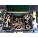 A green leather jewel box. With various costume jewellery etc