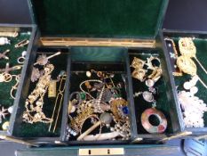 A green leather jewel box. With various costume jewellery etc