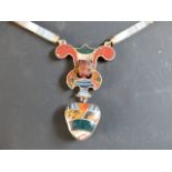 A Scottish peebile agate necklace. With heart shaped pendant drop