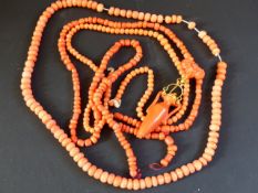 A late 19th Century Greek style carved coral pendant earring and various coral beads