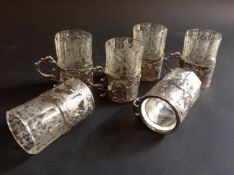A cased set of six silver mounted liqueur glasses. Bears import duty marks. London 1891. A silver