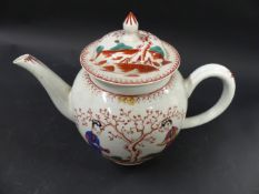 An early Liverpool porcelain teapot. Decorated with two Oriental figures and a flowering tree to
