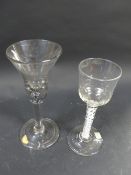 An early plain stem wine glass. With folded foot. 18cm high. Together with a cordial glass with