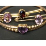 An Edwardian rose gold coloured stiff bracelet. Set with heart shaped amethyst. Together with two