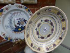 An antique Delft ware dish with polychrome floral decoration