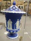 An antique Wedgwood blue jasper ware twin handle urn with pierced cover. 35cm high