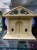 A pair of Wedgwood buff Jasper ware bookends which form a classical building when together and a