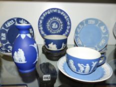 A collection of Wedgwood blue Jasper ware to include cups, saucers, covered boxes, small bud