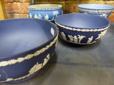 Four various Wedgwood blue Jasper ware deep bowls.