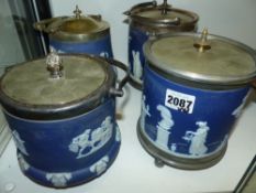 Four Wedgwood blue Jasper ware biscuit barrels with silver plate mounts and lids