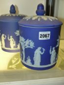Two Wedgwood blue Jasper ware cylinder form covered jars. 20cm high