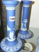 A pair of Wedgwood blue Jasper ware candlesticks. 25cm high