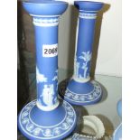 A pair of Wedgwood blue Jasper ware candlesticks. 25cm high