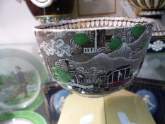 A Staffordshire pottery small bowl with brown transfer decoration of an early steam train,