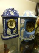 A Wedgwood blue Jasper ware clock case of shaped form, another similar in dark blue case. Height