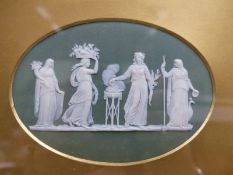 An antique oval Wedgwood green Jasper ware plaque of classical figures. 10 x 15cm