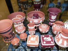 A group of Wedgwood blush Jasper ware and some Cranberry pieces to include bowls, jugs, vases and