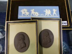 A Wedgwood blue Jasper ware figural plaque entitled Blind Man's Bluff together with two Basalt