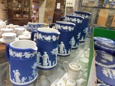 Five graduated Wedgwood blue Jasper ware jugs