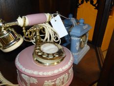An unusual Wedgwood pink Jasper ware boudoir telephone together with two blue Jasper ware clocks.