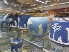 Four Wedgwood blue Jasper ware biscuit barrels with silver plate mounts and swing handles.