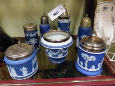 Four Wedgwood blue Jasper ware sugar castors, with silver plate tops, two jam pots and a bowl
