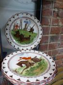 Four Wedgwood pottery plates each decorated with a hunt or sporting scene. Polychrome and lustre