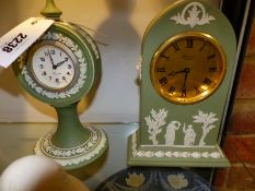 Two Wedgwood green Jasper ware case mantle clocks, one of lancet form the other of circular form