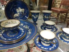 A Wedgwood shallow blue ground bowl with floral decoration. Pattern Z5175. 33cm diameter together