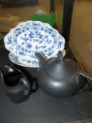 Two Meissen blue and white oval serving dishes in the onion pattern, a Wedgwood black basalt
