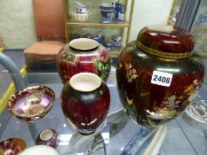 A Crown Devon crimson ground ginger jar and cover. 23cm high. A lustre octagonal bowl decorated with