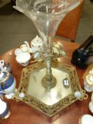 An antique glass epergne on gilt brass and mirrored base inset with Jasperware roundels.