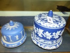 A blue jasperware dome cover cheese dish and a smaller example height of largest 24.5cms.