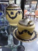 Two Wedgwood cane Jasper ware pieces to include a covered condiment jar and a biscuit barrel with