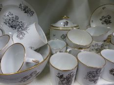 An antique English floral decorated part tea service to include various cups, saucers, cream jug,