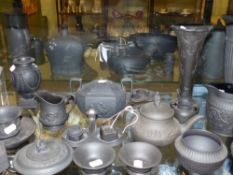 A collection of antique and later Wedgwood and other black basalt wares to include a pair of