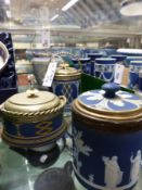 Four Wedgwood blue Jasper ware jars/barrels with metal mounts and lids, three with swing handles,