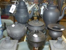 A group of antique and other black basalt wares some by Wedgwood to include two coffee pots, pair of