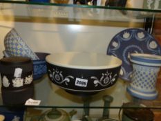 Six pieces of Wedgwood Jasper ware to include three bowls, a plate, a vase and a covered jar, all of