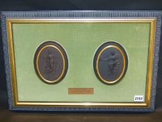 A framed pair of Wedgwood black Basalt oval plaques with gilt banding of classical figures,