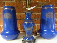 A pair of Royal Worcester blue tapered form bases with stylized floral gilt decoration. 30cm high