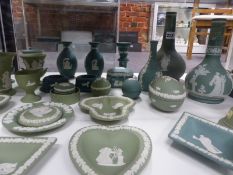 A collection of Wedgwood green Jasper wares to include vases covered boxes, dishes, etc.