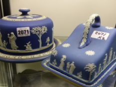 A Wedgwood blue Jasper ware dome top cheese dish and another of wedge shape