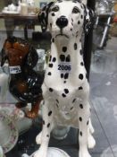 Two Beswick pottery figures of dogs a dalmation and a dachshund. height of largest 36cm