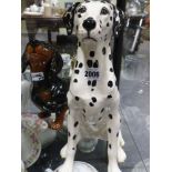 Two Beswick pottery figures of dogs a dalmation and a dachshund. height of largest 36cm