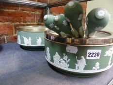 Two Wedgwood green Jasper ware deep bowls with silvered rims and two pairs of servers.