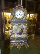 A French Jacob Petit porcelain case clock of impressive size. Decorated on all sides, works by