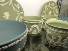 A group of Wedgwood green Jasper ware to include a small pair of jardinieres, a pair of deep