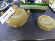 Two pieces of ice yellow Wedgwood Jasper ware to include a round covered box and a covered sugar