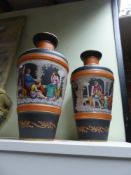 A pair of French porcelain baluster shape vases with polychrome neo grec figural decoration. 40.